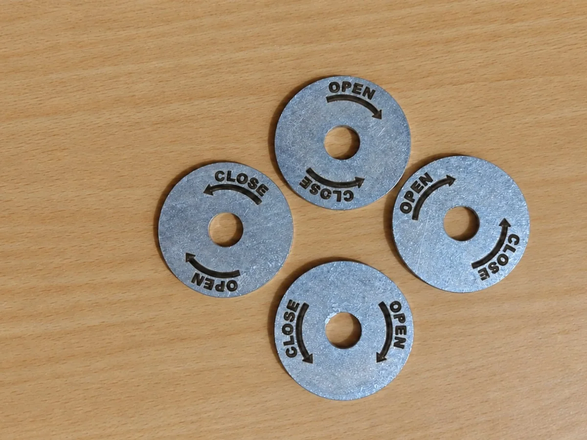Metal ring plates with engraved OPEN and CLOSE labels and arrows